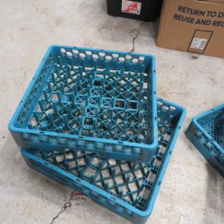 Blue dish rack made from durable plastic, stackable design, good condition, model 2XBID. Suitable for kitchen storage.