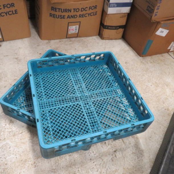 Blue plastic dish rack with grid design, stackable, model 2XBID. Used condition, suitable for kitchen or commercial use.