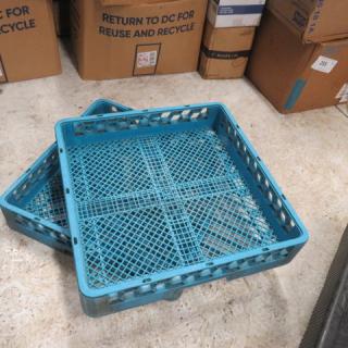Blue plastic dish rack with grid design, stackable, model 2XBID. Used condition, suitable for kitchen or commercial use.