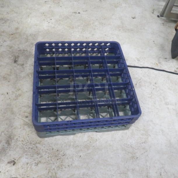 Blue/gray dishwasher rack with 25 holes, sturdy design, minor wear. Ideal for efficient kitchen storage and organization.
