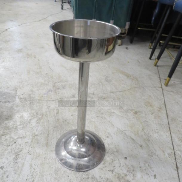 Stainless steel heavy duty wine/champagne bucket holder with a polished finish, featuring a sturdy pedestal base.