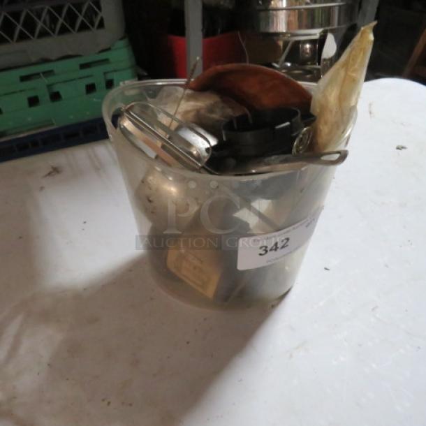 A plastic bucket containing assorted miscellaneous items, auction lot label "342" visible.