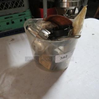 A plastic bucket containing assorted miscellaneous items, auction lot label "342" visible.