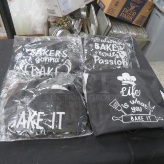 Assorted new aprons with baking-themed slogans in packaging. Includes phrases like "Bakers gonna bake" and "Life is what you bake it."