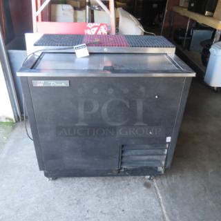 True bottle box cooler on casters, model TD-36-12, 115V, dimensions 37x27x37 inches, black exterior, branded label visible.