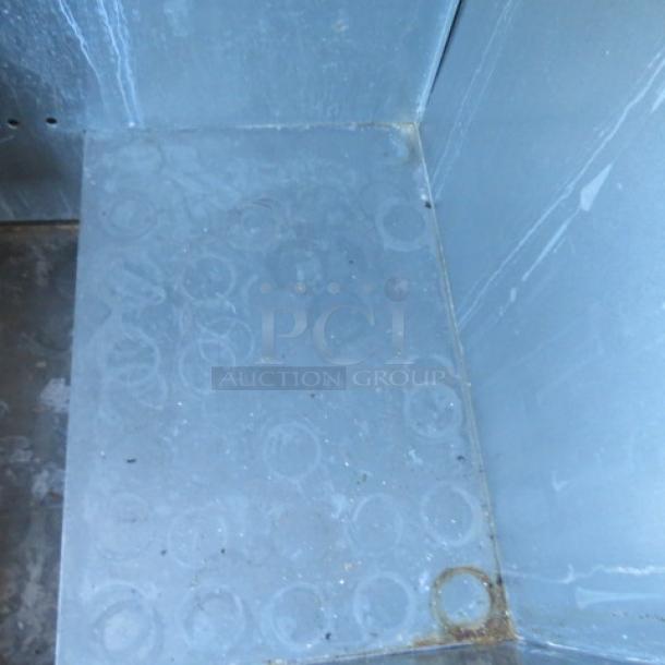 True Bottle Box cooler, model TD-36-12, on casters. Measures 37x27x37 inches. 115 Volt. Appears used.