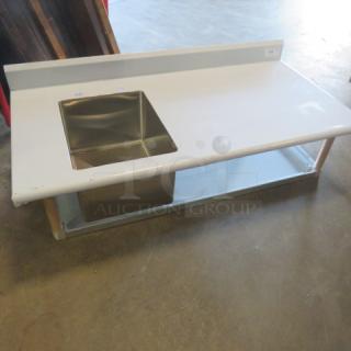 NEW Advance Tabco stainless steel table, 60x30 in., with back splash, sink (16x20 in.), SS under shelf, no legs, in plastic.