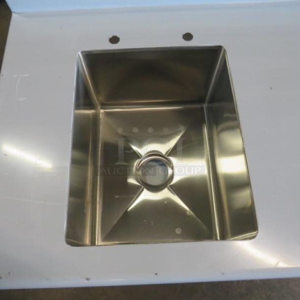 NEW Advance Tabco stainless steel table with sink, back splash, and under shelf. No legs. Size 60x30, sink 16x20.