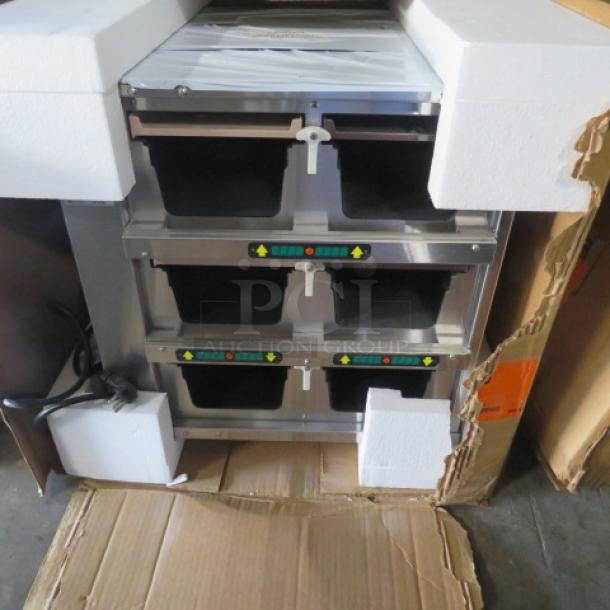 NEW Duke Product Holding Cabinet, Model FWM34, stainless steel, three compartments, new condition, packaging intact.