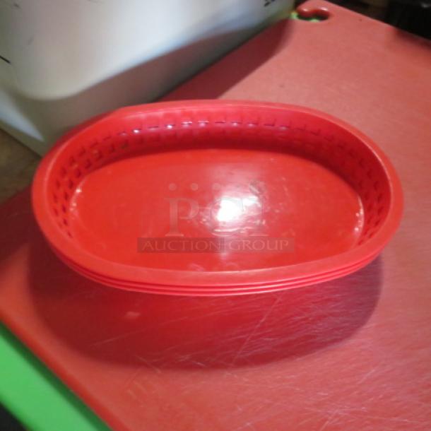Lot of 50 red fast food baskets, 10.5x7.5 inches, sturdy plastic, oval shape, excellent condition. Perfect for restaurants.
