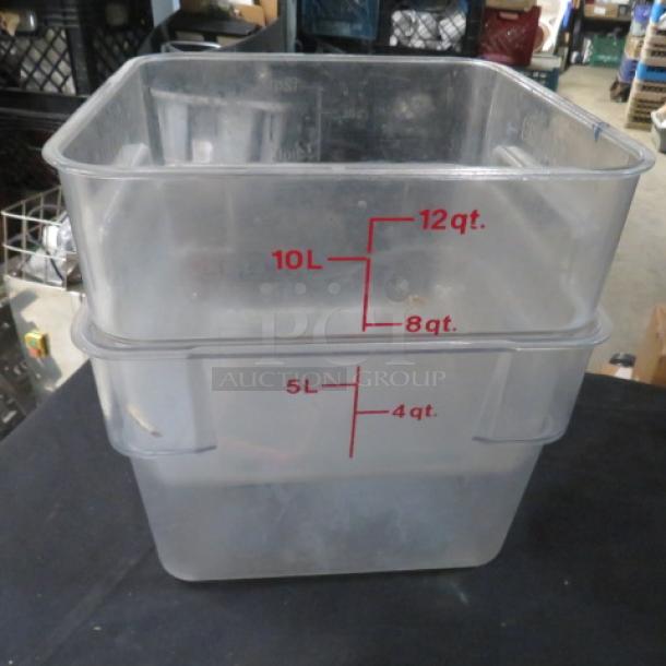 Assorted food storage containers, clear plastic, stackable, with measurement markings in liters and quarts.