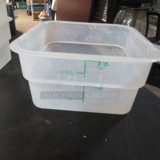 Clear 2-quart food storage container with green measurement markings, indicating volumes from 0.5L to 2L. Appears in good condition.