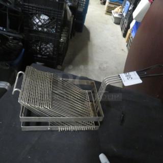 Stainless steel deep fry basket with wire mesh design, dual handles, and numbered auction tag. Good condition.