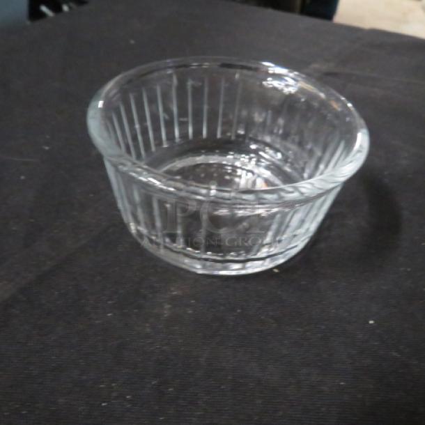 Lot of 50 clear glass ramekins, ribbed design, excellent condition, ideal for baking or serving.