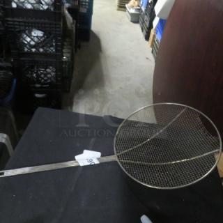 Alt text: Large metal deep fry scoop with mesh wire netting and long handle, in good condition. Tag labeled "59" attached to handle.