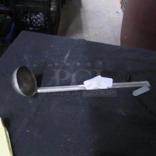 4oz stainless steel ladle with long handle, in good condition. Visible marking "5XBID" on tag.