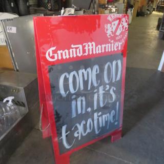 Red Grand Marnier 24x39.5 sidewalk sign with white text, "come on in, it's taco time!" on blackboard. Good condition.