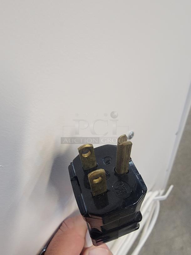 Close-up of a three-pronged plug for the Abatement Technologies HC800FUV air purifier, highlighting electrical compatibility.