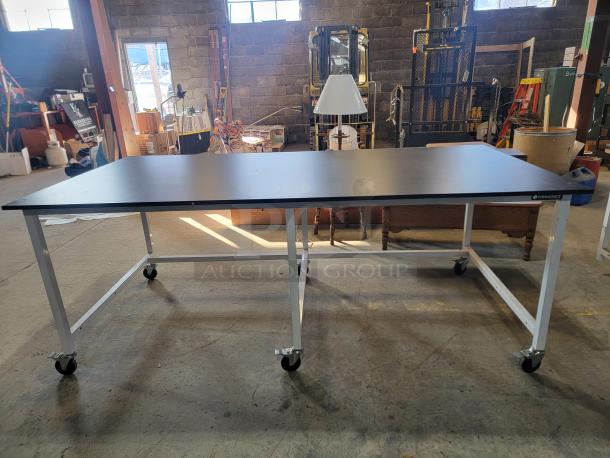 Formaspace Industrial Mobile Workbench, 8'x4', black tabletop, welded steel frame, locking casters, durable, USA-made.