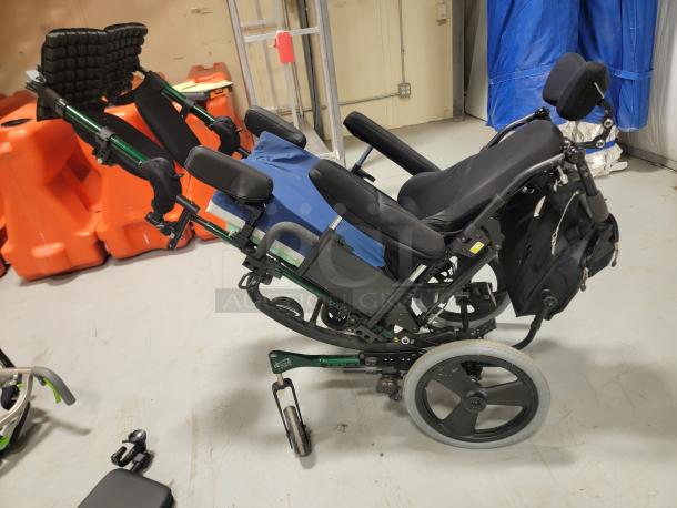 Quickie IRIS tilt-in-space wheelchair, excellent condition, with JAY backrest, pressure-relieving cushion, and elevating leg rests.