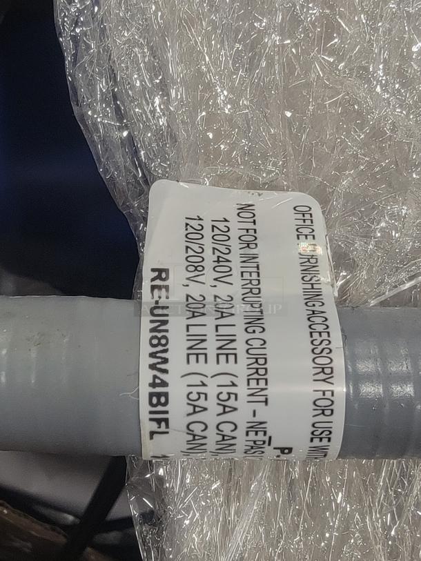 Label on office furnishing accessory indicating electrical specifications: 120/240V, 20A line (15A CAN). For use with AIS systems.