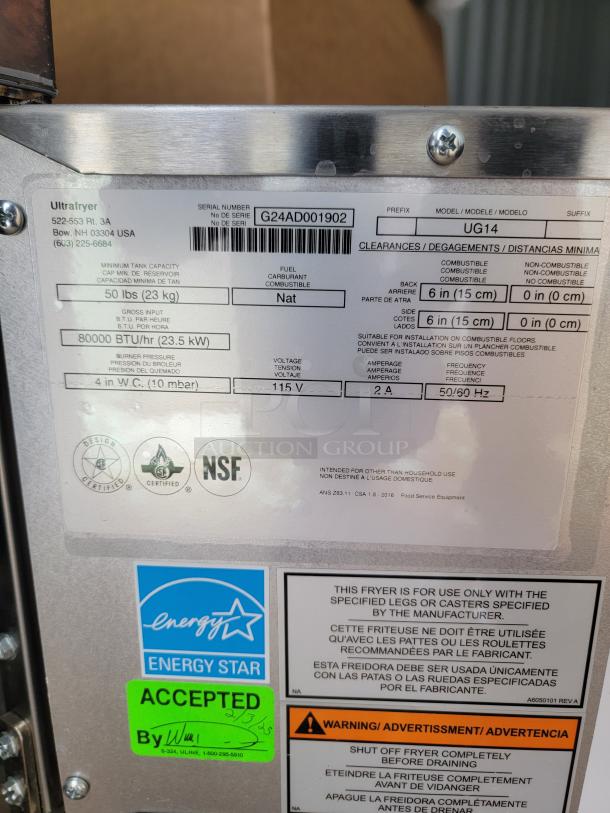 Brand new Pitco Ultrafryer UltraGold UG14 dual vat fryer with protective film. Includes labels for model, energy, and acceptance.