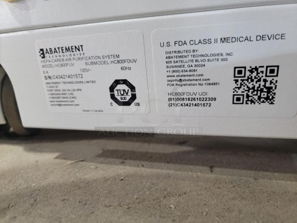 Abatement Technologies HC800FUV air purifier, medical-grade, label shows model, serial number, FDA class, and contact info.