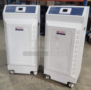 Abatement Technologies HC800FUV air purifiers, medical-grade, white, on wheels, visible brand label, industrial setting.