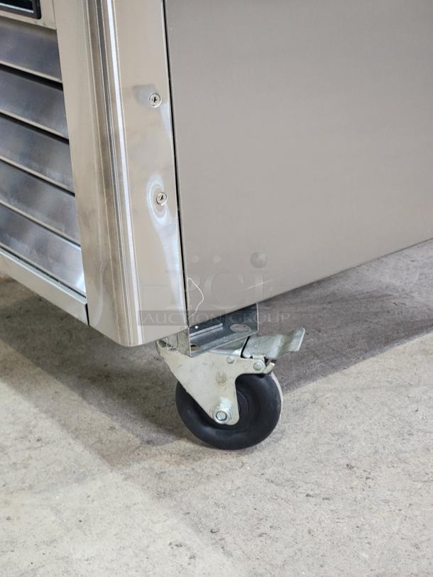 North American Restaurant Equipment A1GDC-GR glass door refrigerator, like new, on durable casters for easy mobility.