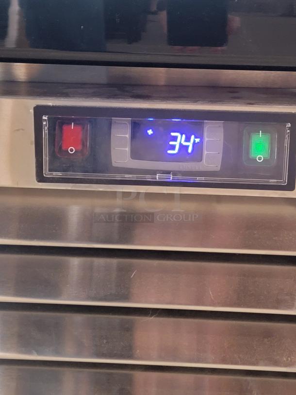 Digital display of North American Restaurant Equipment refrigerator model A1GDC-GR showing temperature at 34°F.