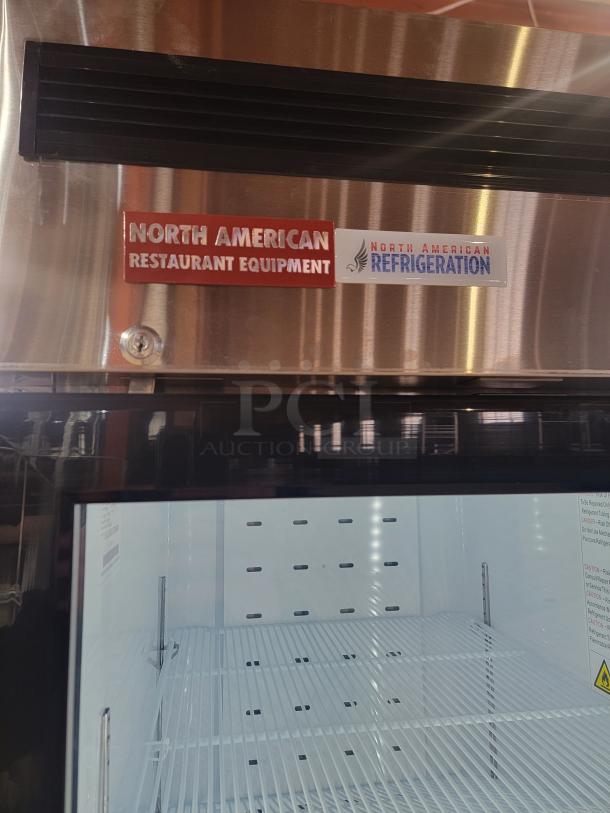 North American Restaurant Equipment glass door refrigerator, model A1GDC-GR, with LED lighting and digital display, like new.