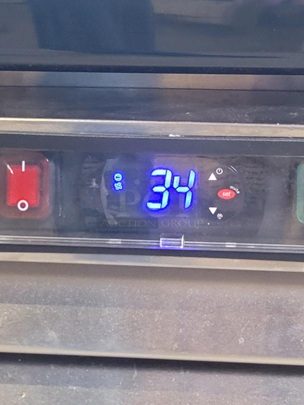 2021 North American Restaurant Equipment A2GDF-GR digital temperature controller displaying 34°F, indicating operating condition.
