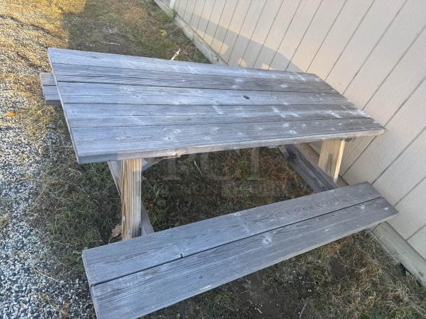 Heavy-duty 8' picnic table with A-frame design, showing natural patina. Ideal for large gatherings, sturdy condition.