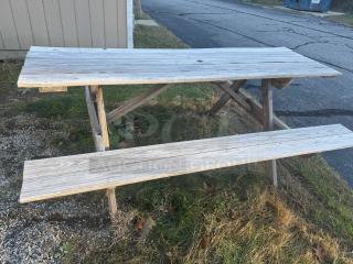 6-foot wooden picnic table with A-frame design, natural patina, very sturdy, suitable for gatherings, DIY staining potential.