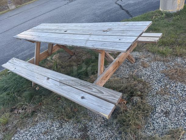 Heavy-duty 6-foot wooden picnic table, A-frame design, natural patina, sturdy, ideal for gatherings, easily refinished.