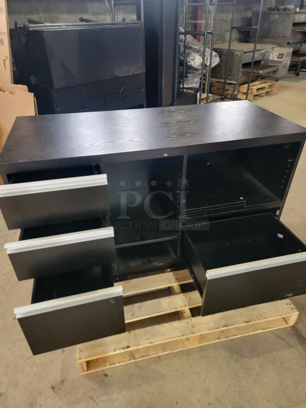 Black Premium Cash Wrap, 55" Deluxe model by Premium Retail Fixtures. Features wood-grain finish, smooth-glide drawers, open storage.