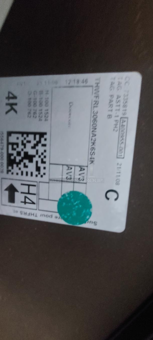 Steelcase Flip-Top Training Table, Model THWFRL3060NA2K6S4K. Features wood laminate top, flip-top mechanism, and locking casters.