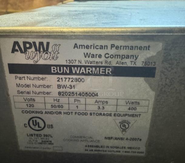 APW Wyott BW-31 Bun Warmer label showing specs: 120V, 400W, Part 21772800, UL, NSF certified; silver, durable, flexible neck.
