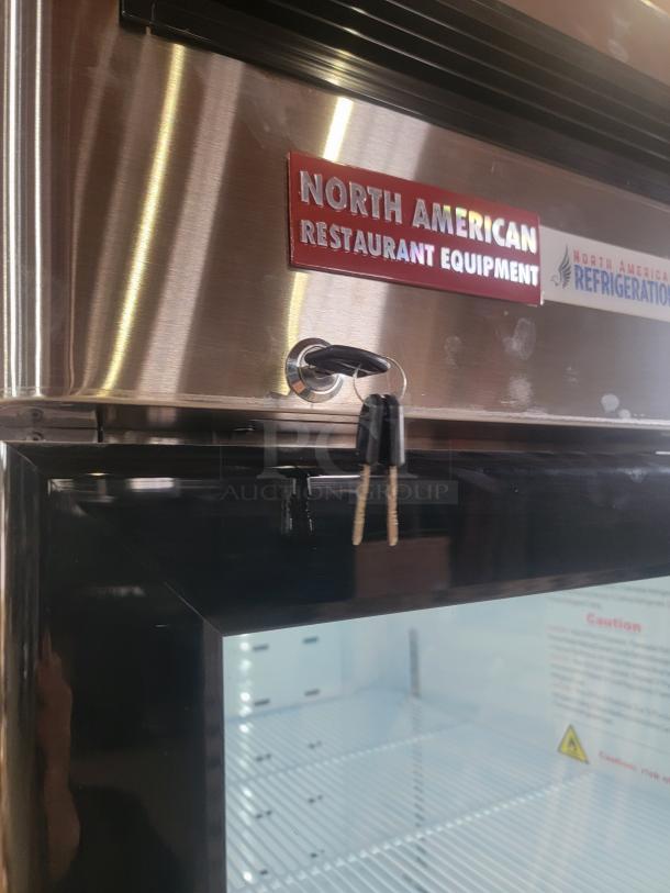 North American Restaurant Equipment A1GDC-GR glass door refrigerator with keys, LED lighting, on casters, like new condition.