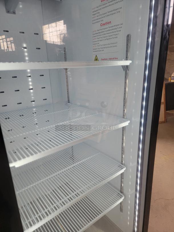 North American Restaurant Equipment A1GDC-GR commercial refrigerator with glass door, bright LED lighting, and adjustable shelves.