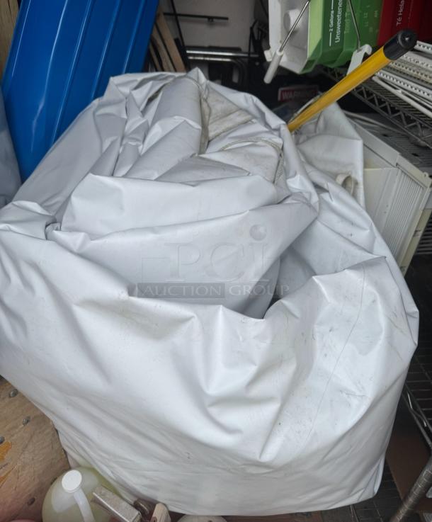 20'x40' premium white vinyl tent, commercial-grade, by Tent and Table, model BT-FW24WT3P, folded for storage.