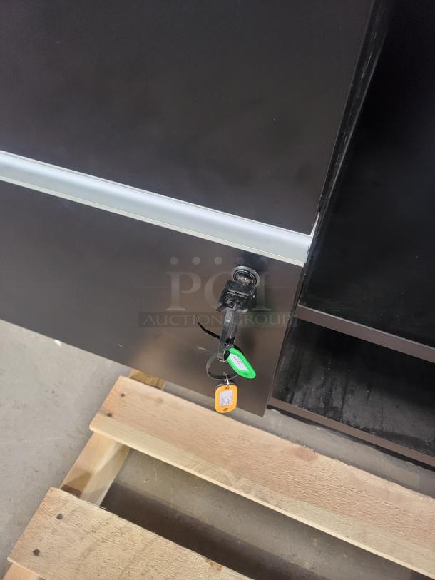 Black Premium Cash Wrap counter, modern design by Premium Retail Fixtures, 55" model with wood-grain finish, open storage.