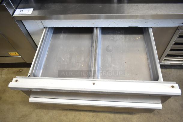 Cooltech commercial 2 drawer chef base on casters, open to show stainless interior. Powered by 115 volts, 1 phase.
