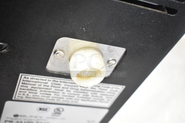 2017 Bunn LCA-1 liquid coffee dispenser, 120V, low profile design. Close-up of spout and label with specifications.