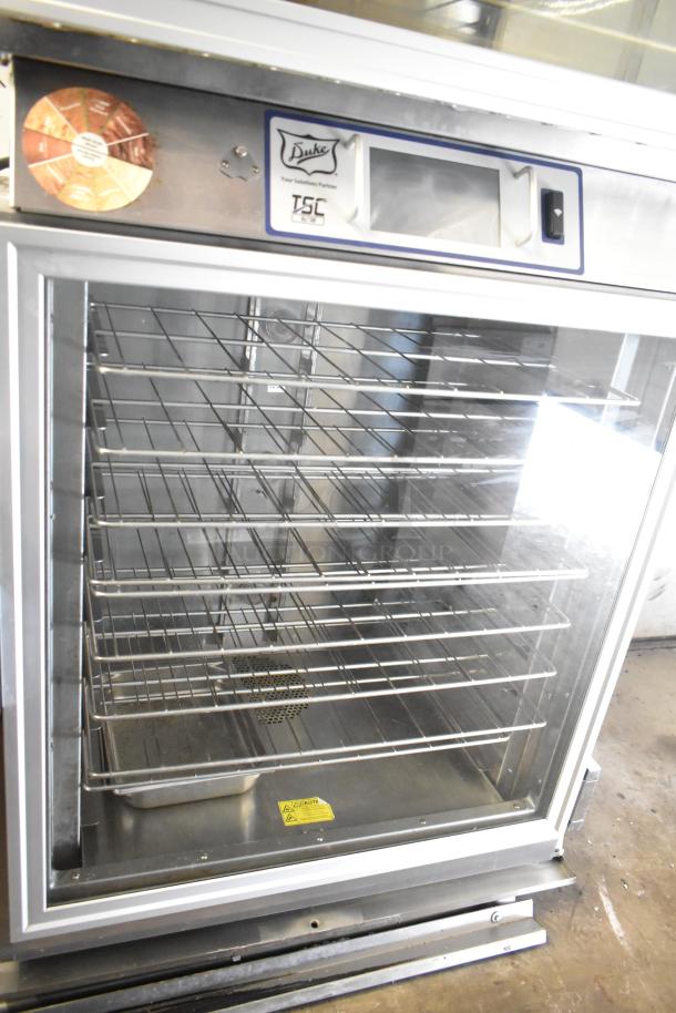 Duke TSC3-6/18 commercial oven proofer on casters, stainless steel, 208V, 3 phase, visible control panel, and shelves.