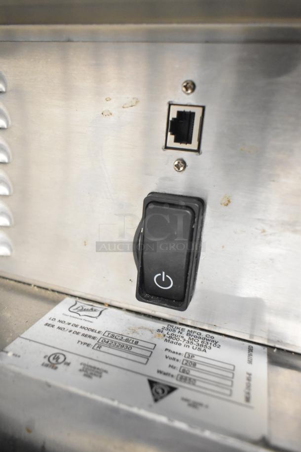 Duke TSC3-6/18 commercial oven proofer, labeled with model and serial number on stainless steel surface.