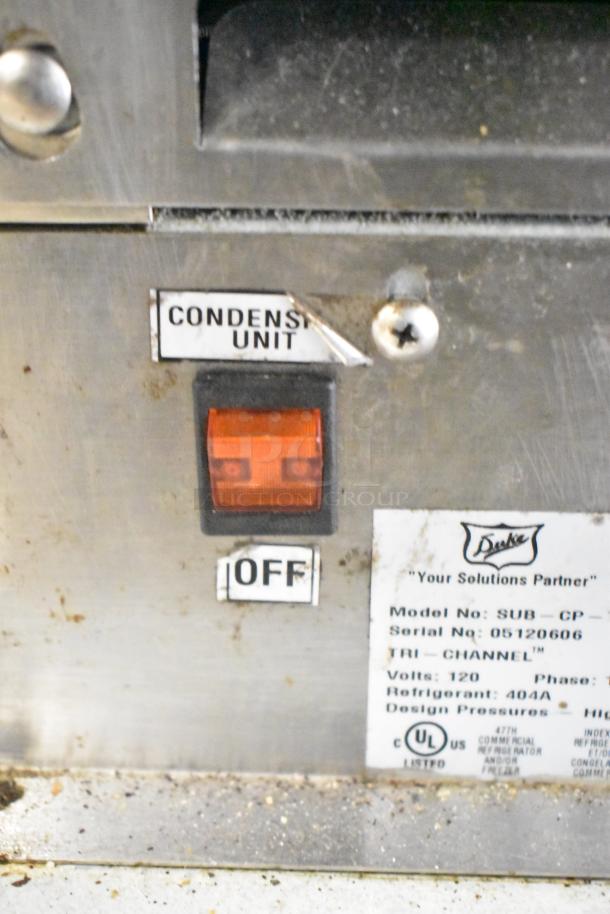 Duke SWD700-60LED M sandwich prep line controls; features condenser unit switch and model label, 120V, 1 Phase.