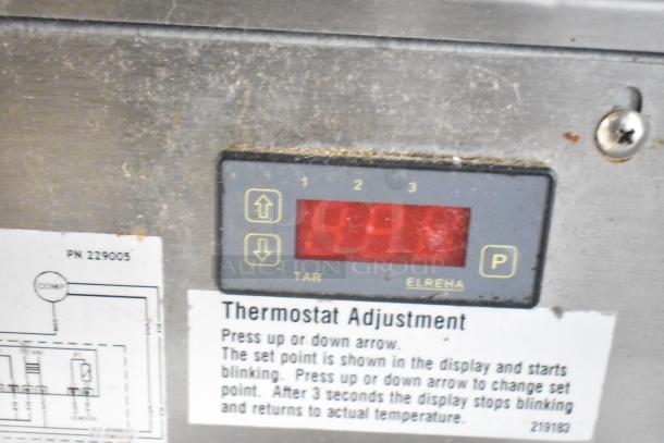 Duke SWD700-60LED M thermostat display showing temperature control, with instructions for adjustment.
