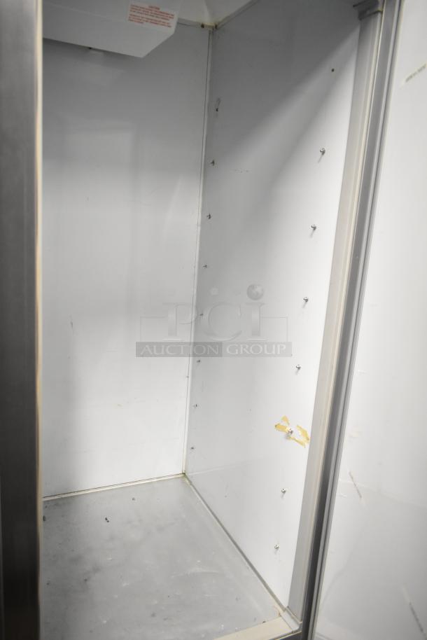 Beverage Air KR48-1AS commercial cooler interior, showing wear. Two-door, 115V, 1 phase, spacious reach-in design.