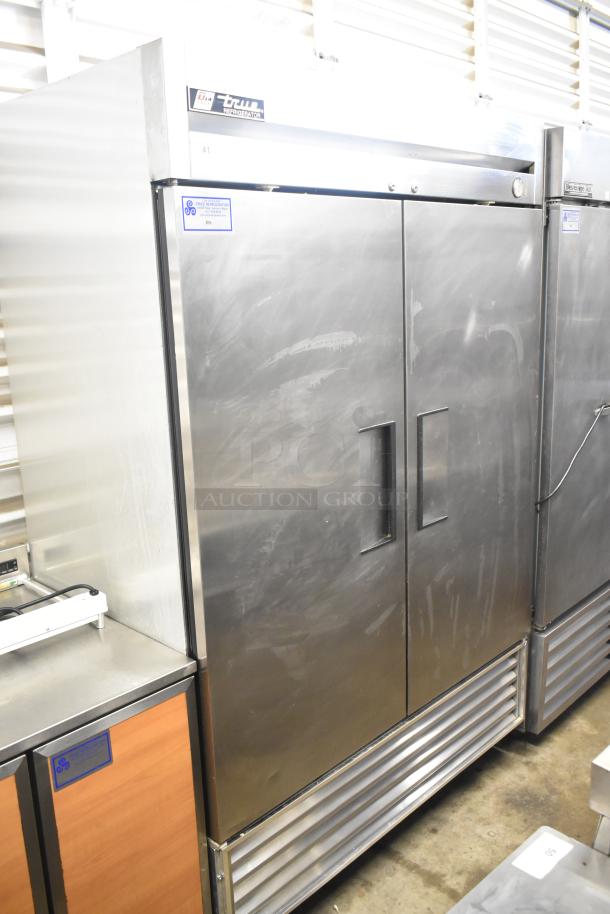True T-49 Commercial 2 Door Reach-In Cooler, stainless steel, used condition. 115 volts, 1 phase. Model and brand labels visible.